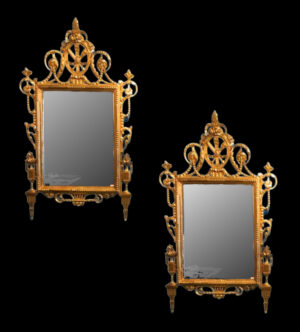 Pair of carved mirrors, gilded with fine gold.