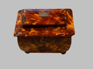 Domed Tea Box, made of tortoiseshell with silver feet.