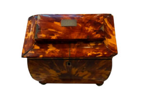 Domed Tea Box, made of tortoiseshell with silver feet.