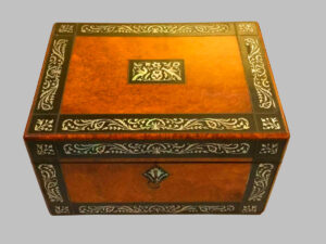 Walnut roots desk box with mother-of-pearl inlays.