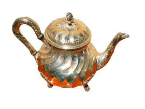 Silver teapot with handle.