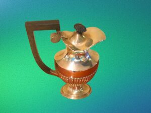 Silver coffee pot with black lacquered wooden handle.