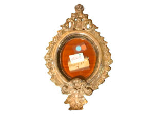 Hand-chiseled silver frame.