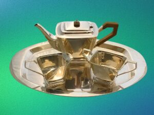 Juego de Té y Bandeja ovalada y 3 piezas de Plata.