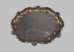 Silver oval tray with chased edges.