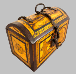 Box with a domed lid with wrought iron inlays and hardware.